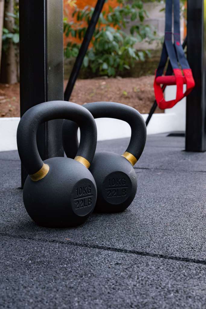 Weights on the pavement of the Lampuga Fitness Camp outdoor gym