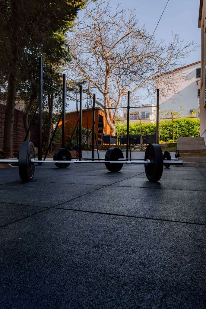 Lampuga Fitness Camp outdoor gym, weights on the floor