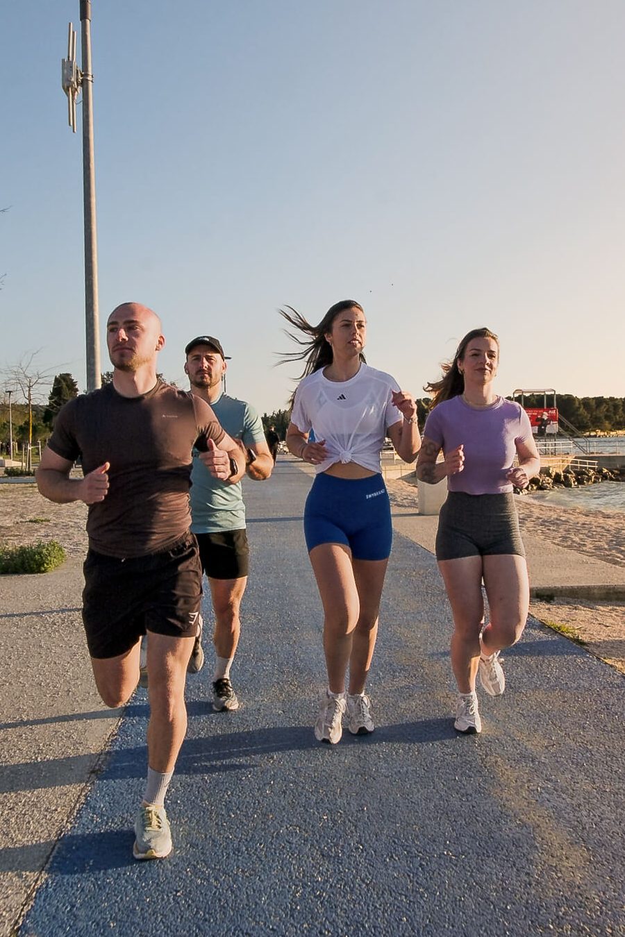 Lampuga Fitness Camp participants running together in the morning
