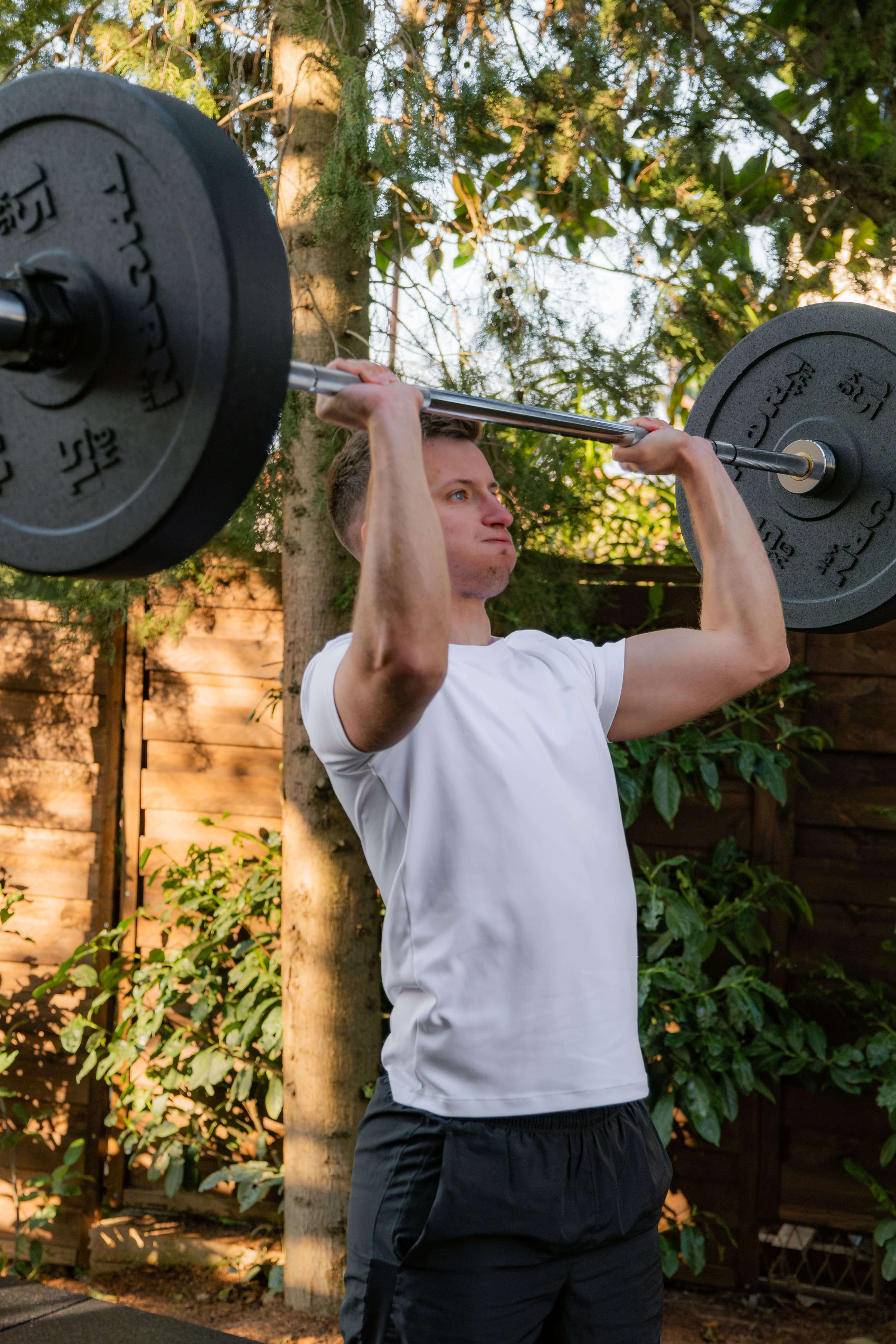 Lampuga Fitness Camp participant lifting weights